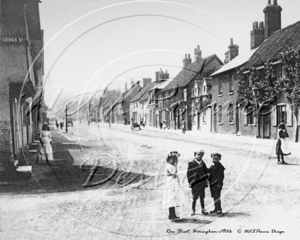 The bottom end of Rose Street looking towards Broad Street, Wokingham, Berkshire c1900s. The child in the middle is Brian Hussey who lived half way down Rose Street.