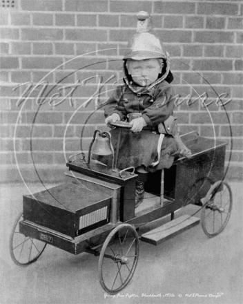 Young lad playing as a Fireman, Blackheath in South East London c1900s